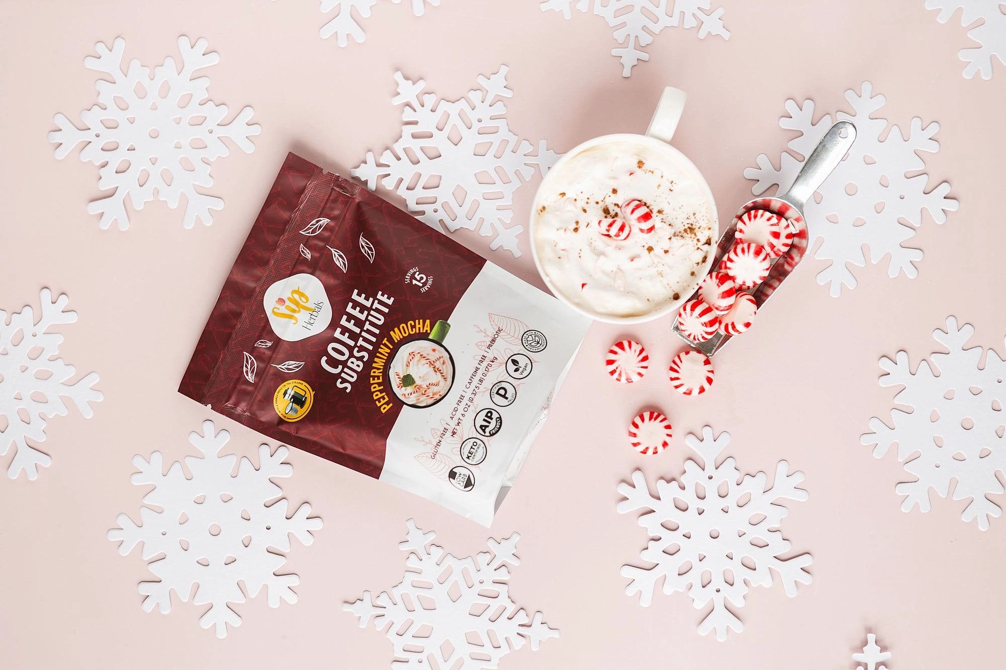 Peppermint Mocha herbal coffee alternative bag on a snowflake backdrop